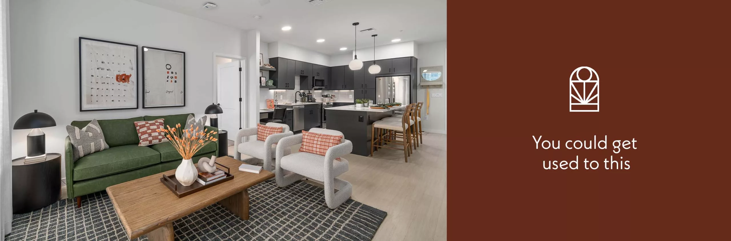 Modern open-concept living room and kitchen with stylish furnishings and neutral tones.